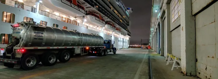 Rosano Davis tanker truck servicing a cruise ship at night