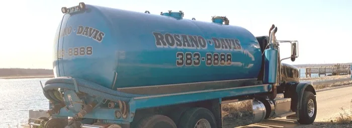 Rosano Davis tanker truck pumping a septic system along the South Shore coastline