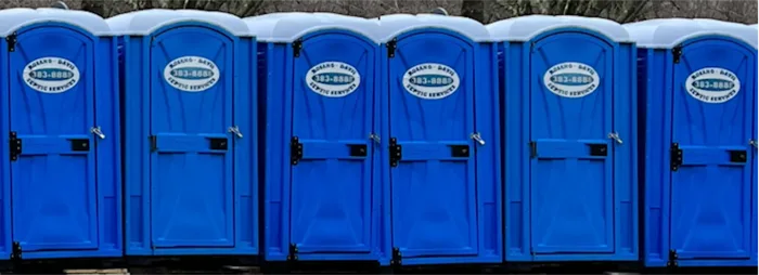 Row of branded Rosano Davis portable toilets