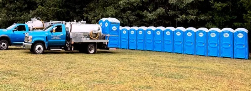 Rosano Davis service truck and portable toilets on a construction jobsite