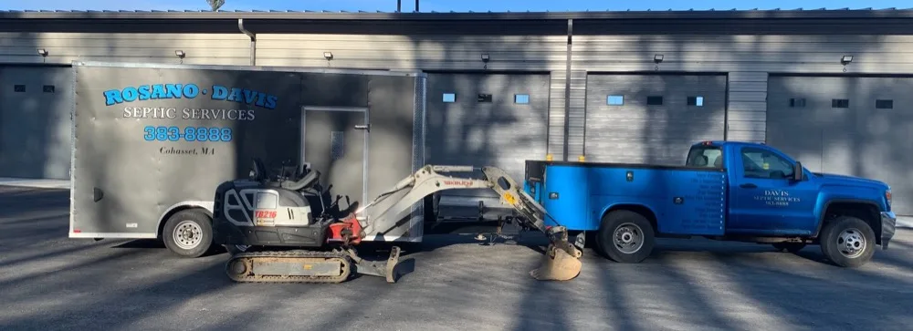 Rosano Davis Septic Services equipment trailer and excavator listing site work, drain layout and pump chamber repair services